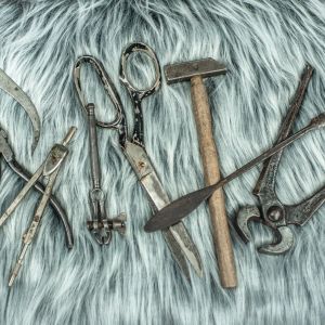 Some of the hand tools we use regularly at work displayed on grey faux fur