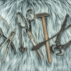 Some of the hand tools we use regularly at work displayed on grey faux fur