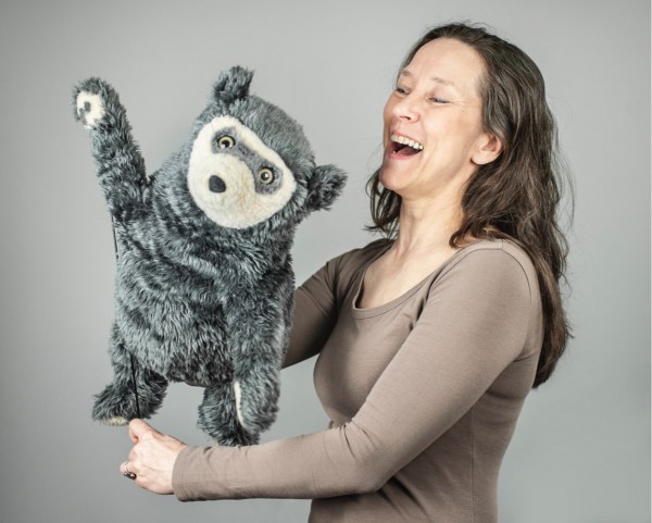 A portrait of Tiina and a waving Bo Bear